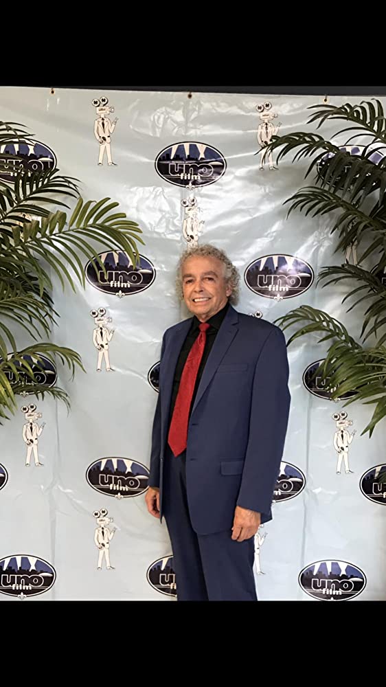 Bill Rainey at event backdrop