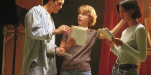 Bill Rainey directing young actors on stage